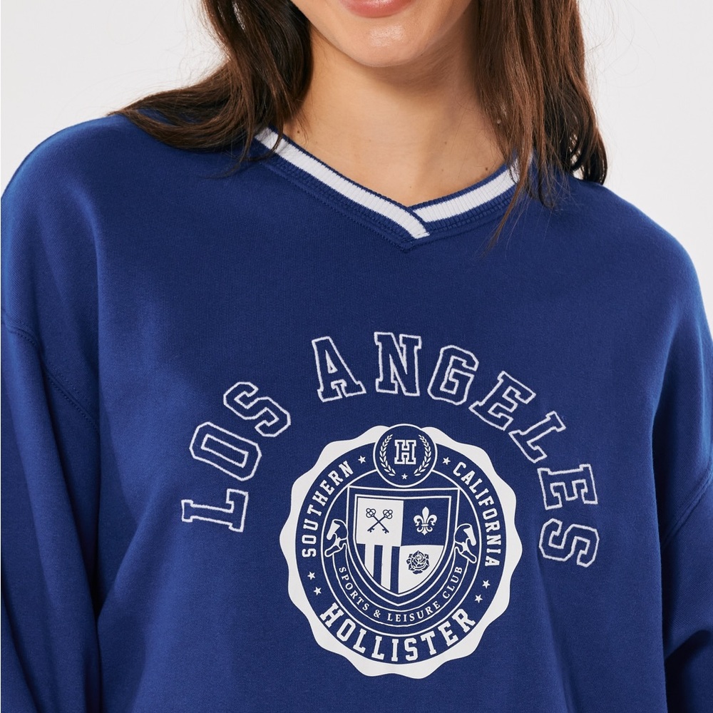 Hollister Oversized Blue and White Varsity Vneck Los Angeles Sweatshirt